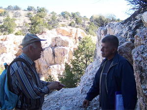 Faculty having a dicsussion in the field